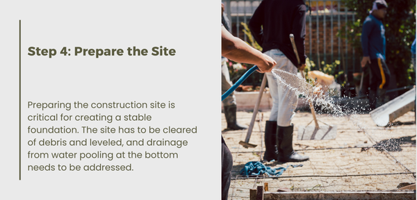 A man waters a vibrant garden using a hose, nurturing the plants for healthy growth and flourishing blooms.