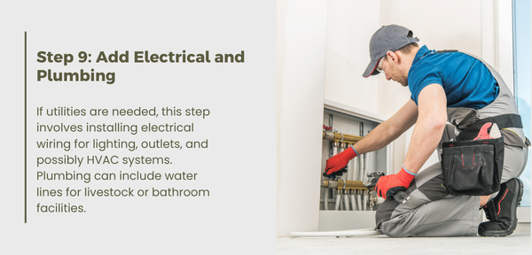 A man installs plumbing in a barn, ensuring proper utility placement for functionality and safety standards.