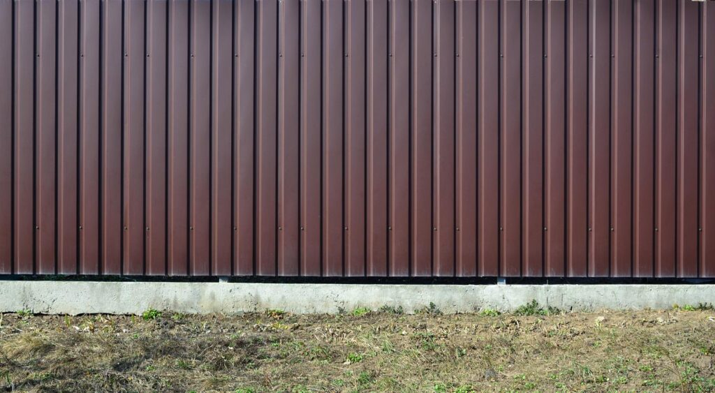Siding, metal panels texture closeup in the daytime outdoors